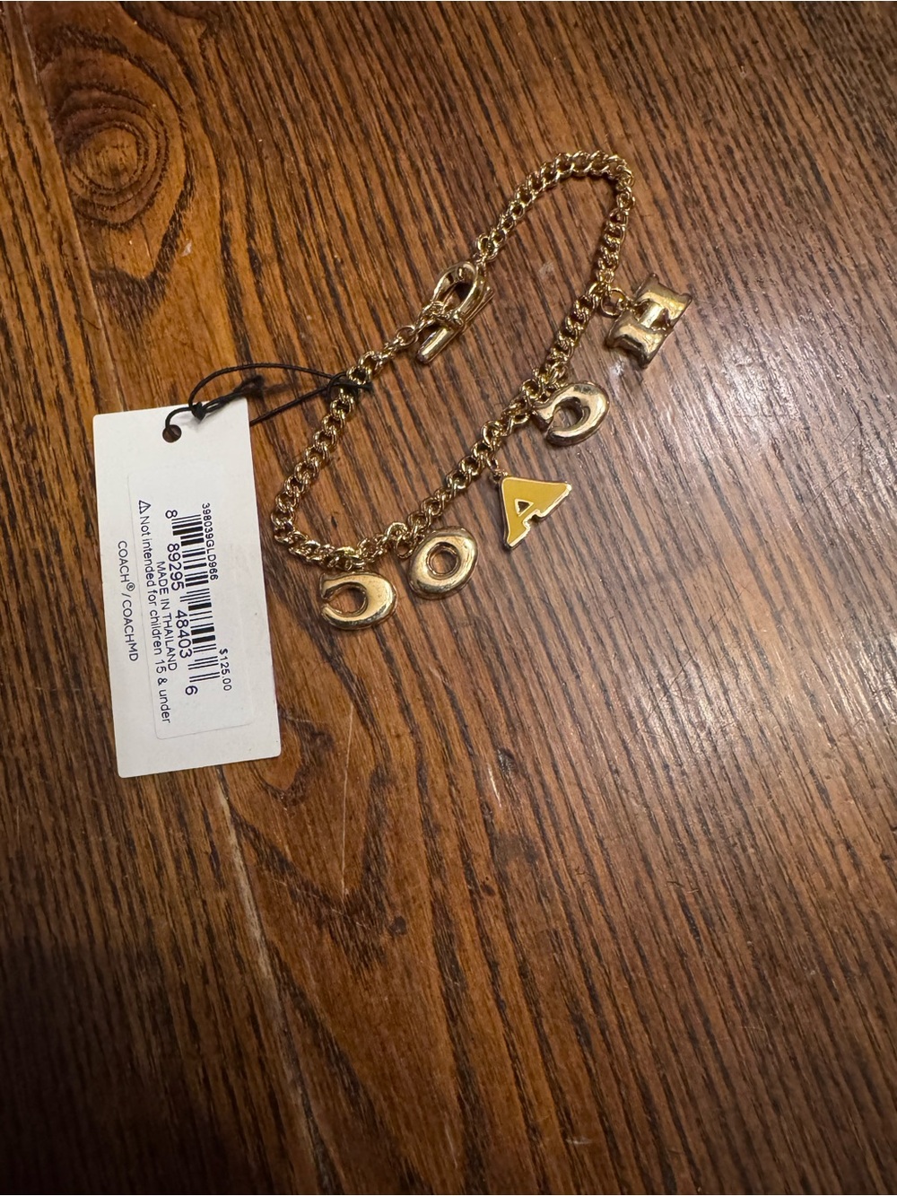 Coach Gold-Tone Charm Bracelet with Colored Accents - Picture 2 of 3